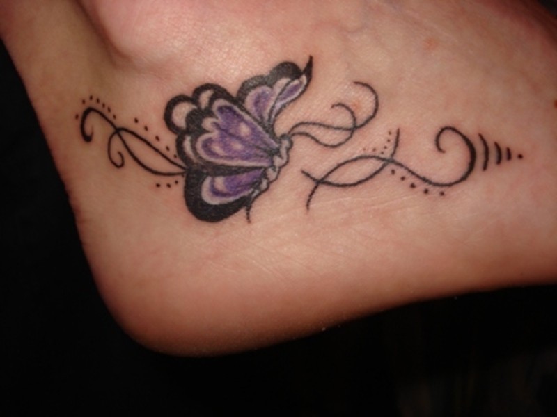 Purple small butterfly tattoo on foot