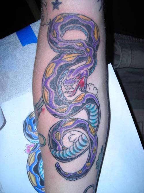 Purple snake tattoo on leg