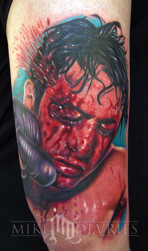 Real lifelike colored bloody boxer face tattoo on shoulder