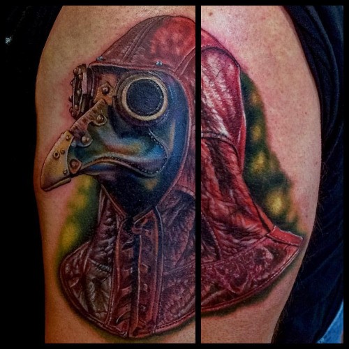 Real lifelike shoulder tattoo of plague doctor in leather suit