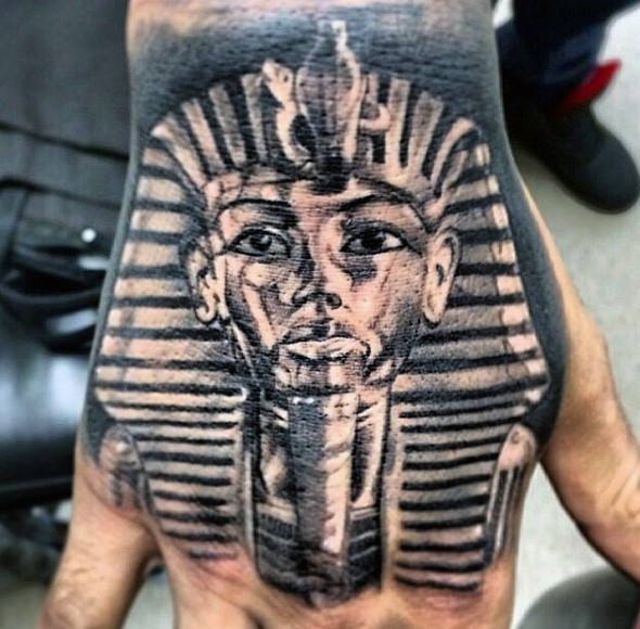 Real photo like black and white hand tattoo of pharaoh statue