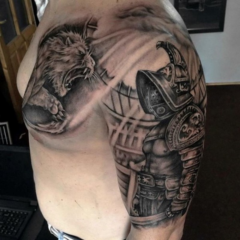 Real photo like black and white shoulder tattoo of gladiator fighting lion