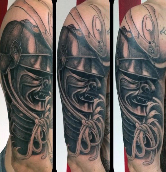 Real photo like black and white upper arm tattoo of samurai helmet