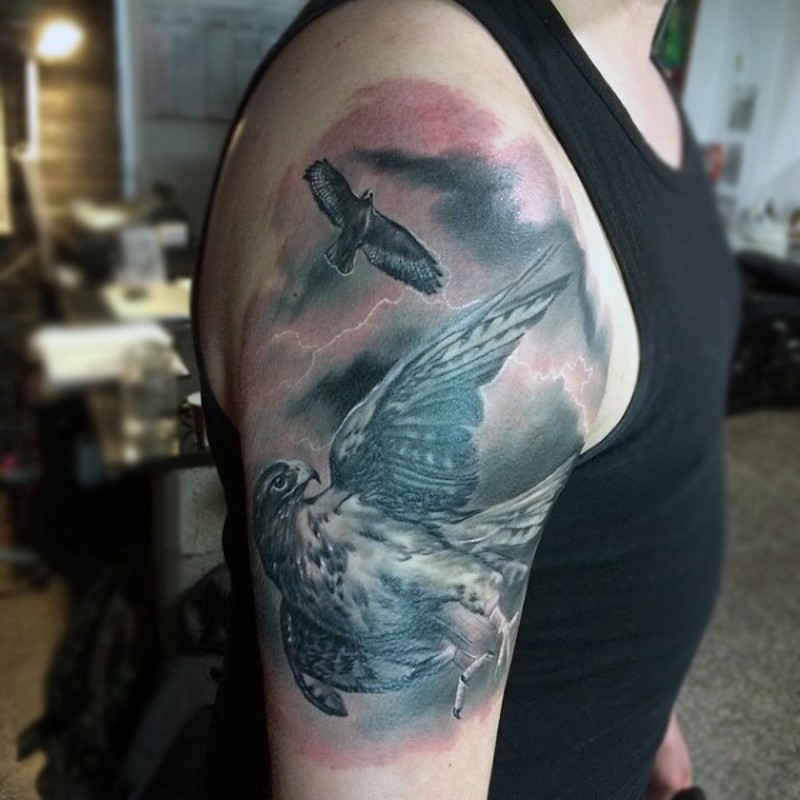Real photo like colored detailed shoulder tattoo of flying eagles