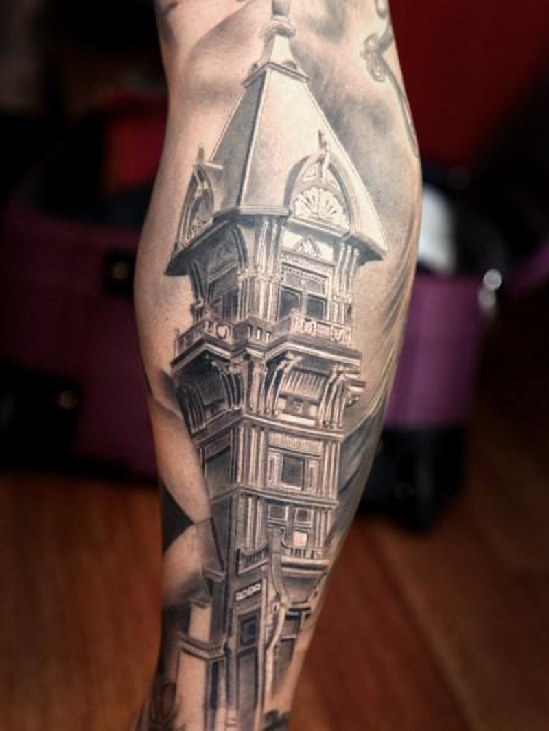 Real photo like colored leg tattoo of old detailed tower