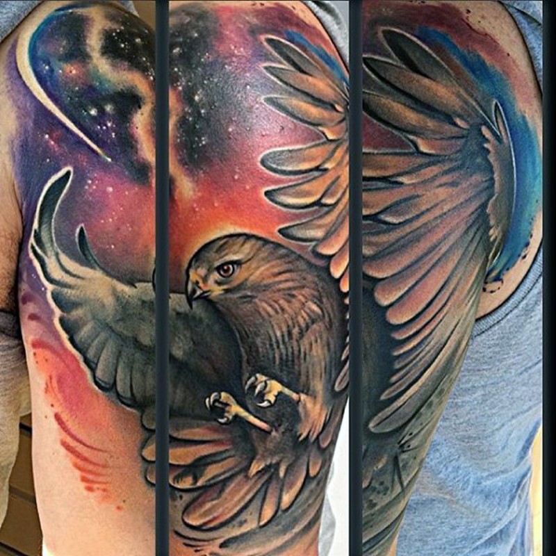 Real photo like colored shoulder tattoo of flying eagle and space