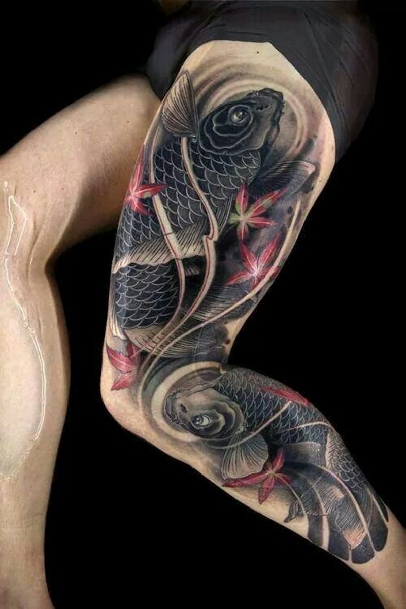Real photo like colored thigh tattoo of big carp fishes