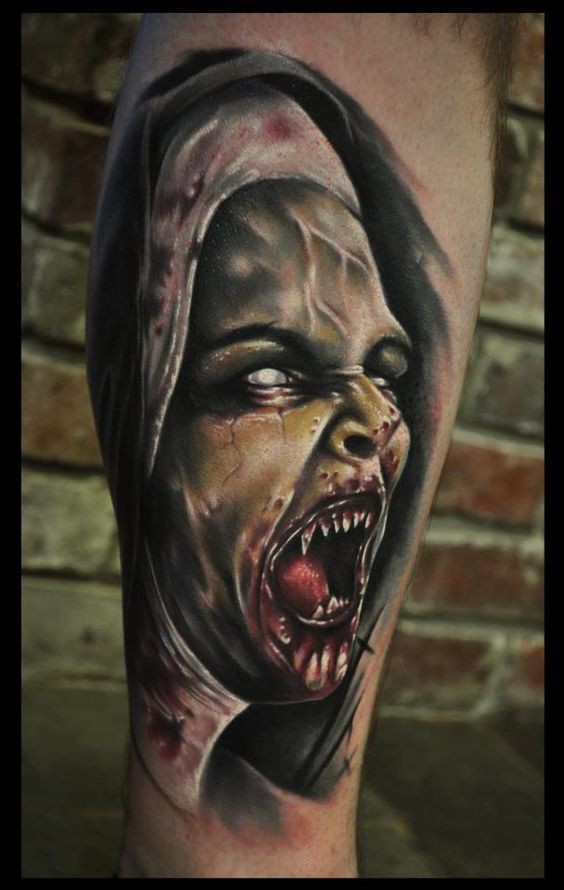 Real photo like colorful forearm tattoo of bloody vampire woman portrait