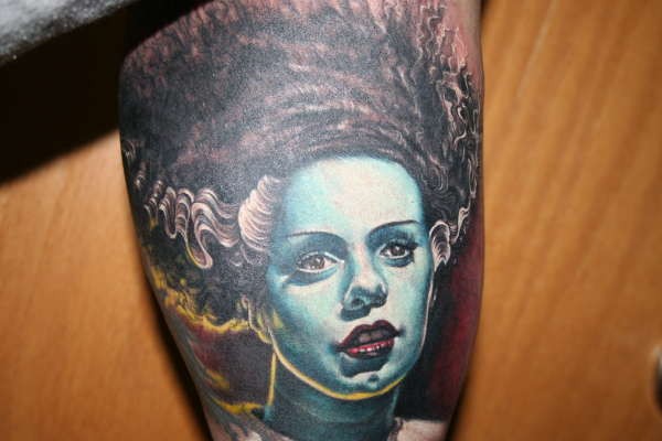 Real photo like creepy horror woman tattoo on leg