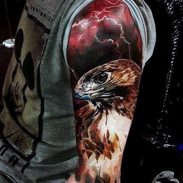 Real photo like detailed and colored eagle with lightning tattoo on sleeve