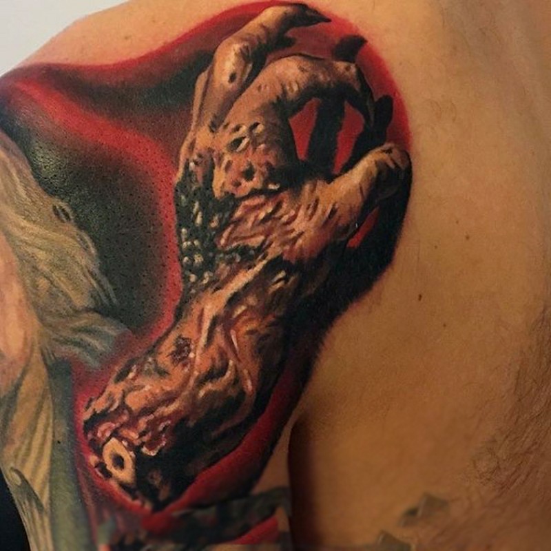 Real photo like magnificent colored shoulder tattoo of realistic zombie arm