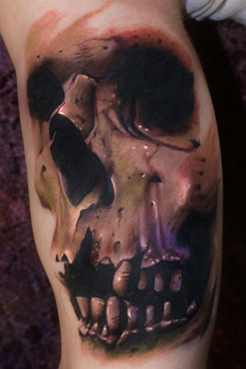 Real photo style colored and detailed biceps tattoo of human skull