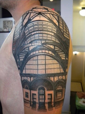 Realism style black ink old railway station photo tattoo on upper arm