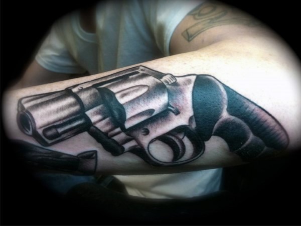 Realism style colored 3D forearm tattoo of old revolver