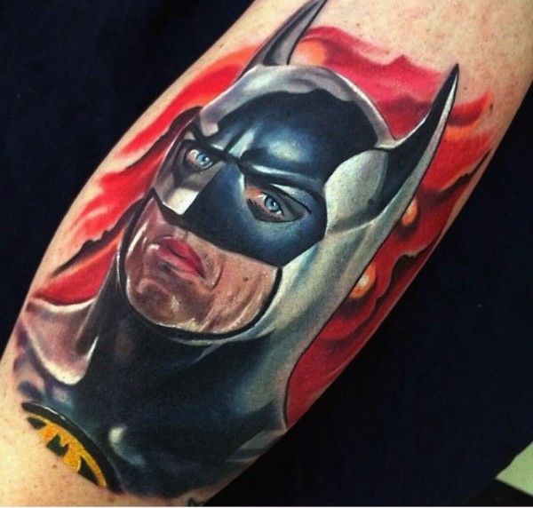 Realism style colored arm tattoo of Batman face