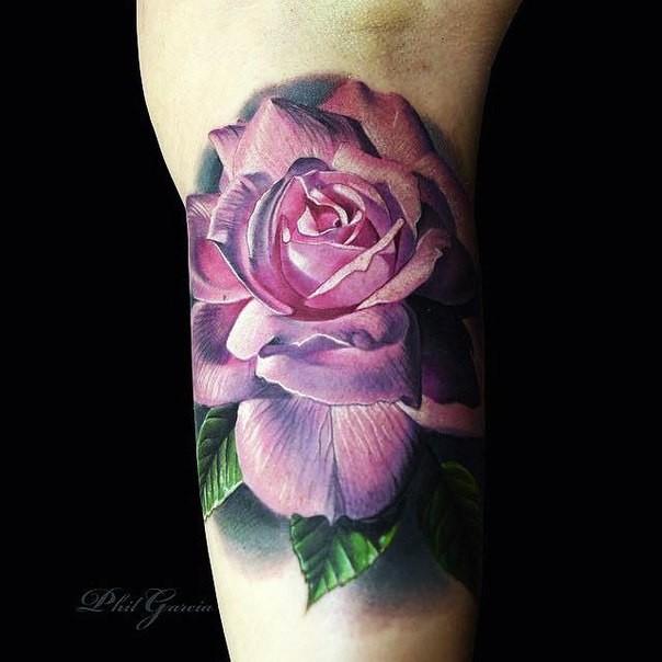 Realism style colored arm tattoo of big pink rose
