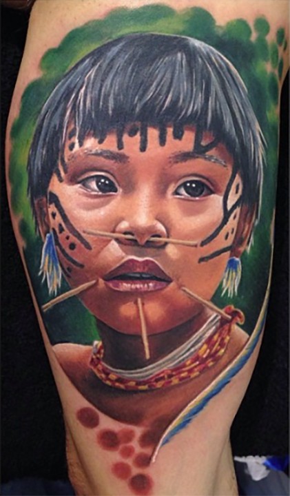 Realism style colored arm tattoo of boy portrait