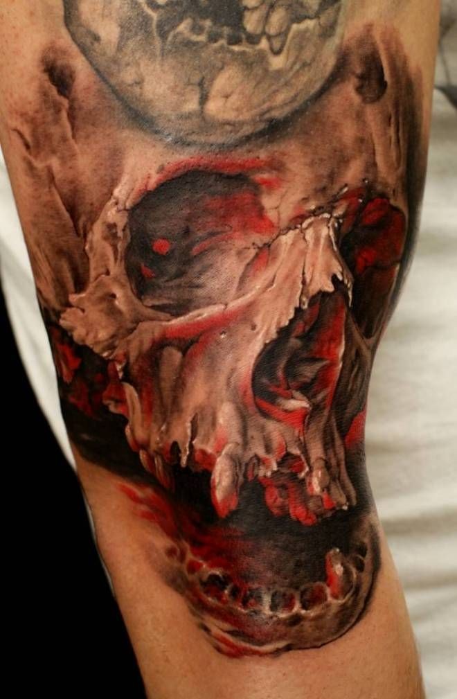 Realism style colored arm tattoo of human skull