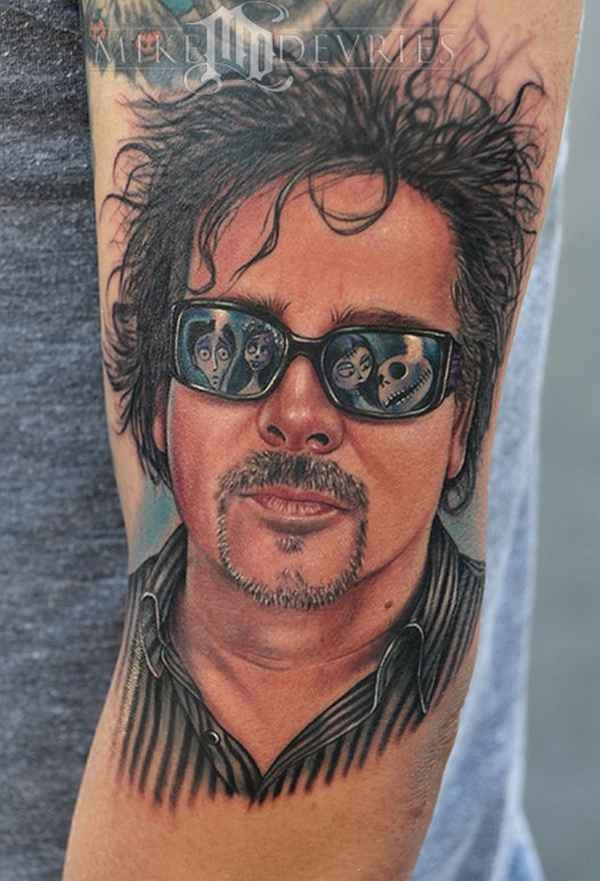 Realism style colored arm tattoo of man in sun glasses
