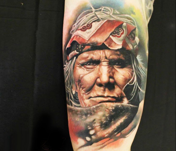 Realism style colored arm tattoo of old Indian