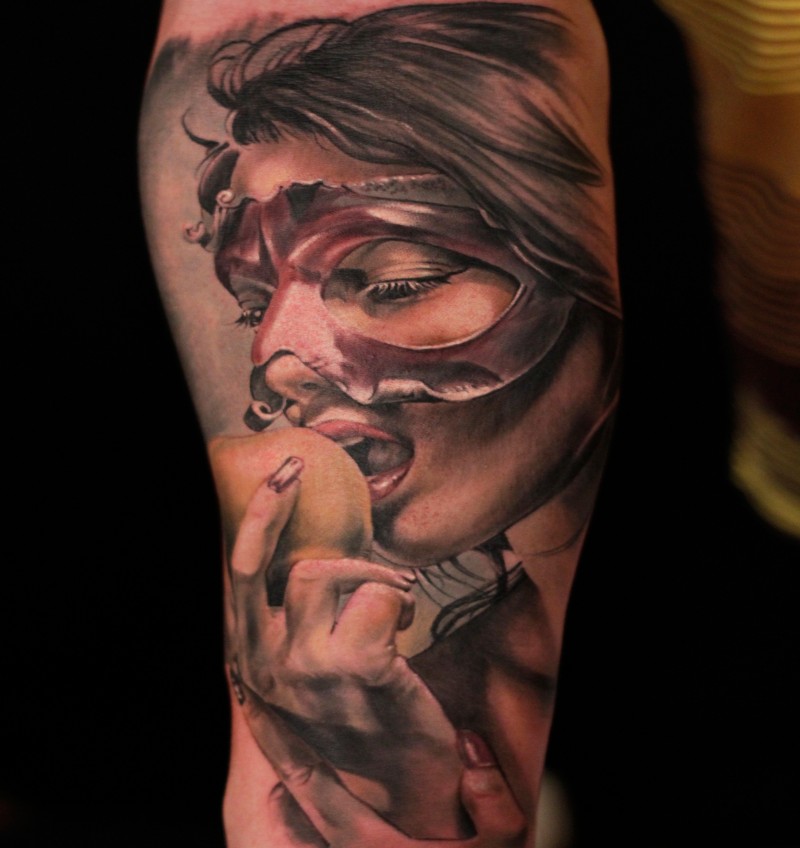 Realism style colored arm tattoo of woman with mask and apple