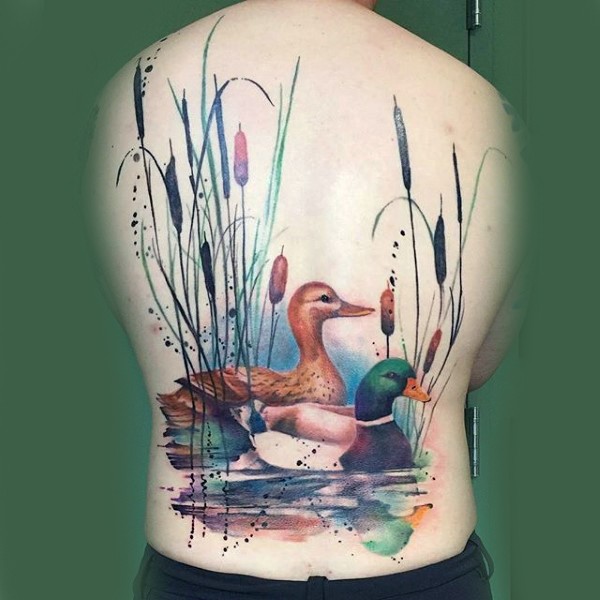 Realism style colored back tattoo of swimming wild ducks