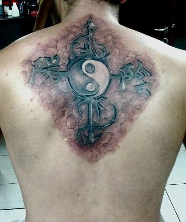 Realism style colored back tattoo of cross with Yin Yang symbol