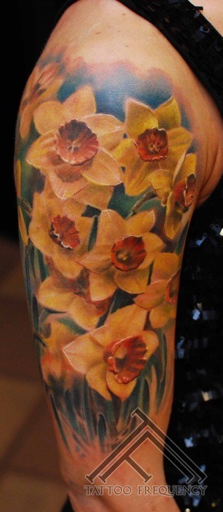 Realism style colored flowers tattoo on shoulder