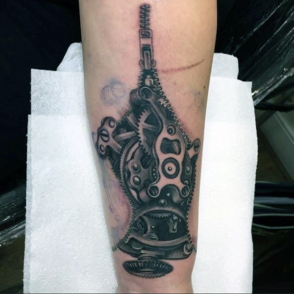 Realism style colored forearm tattoo of zipper with mechanical parts