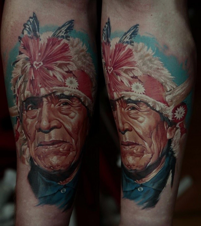 Realism style colored forearm tattoo of Indian face