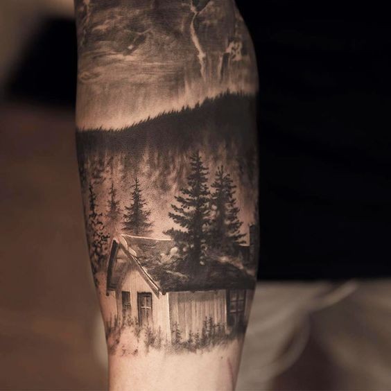 Realism style colored forearm tattoo of forest house with night sky