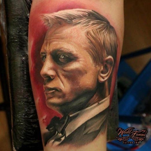 Realism style colored forearm tattoo of James Bond Portrait