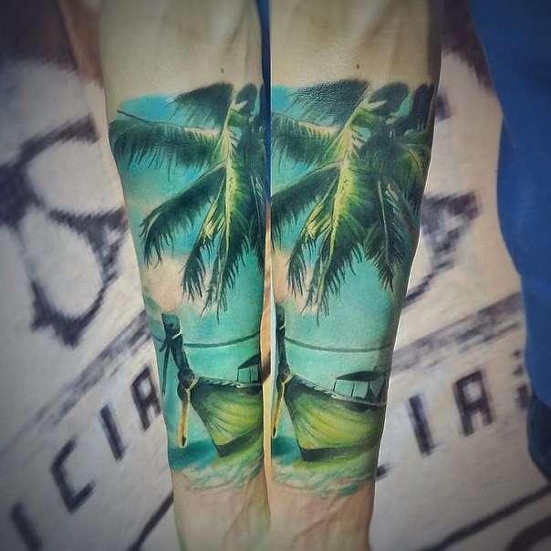 Realism style colored forearm tattoo of palm tree with boat