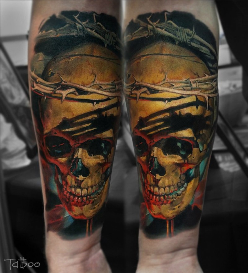 Realism style colored forearm tattoo of bloody human skull with vine