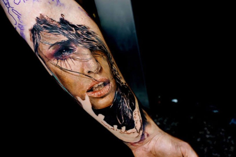 Realism style colored forearm tattoo of woman face
