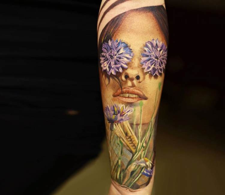 Realism style colored forearm tattoo of woman with flowers