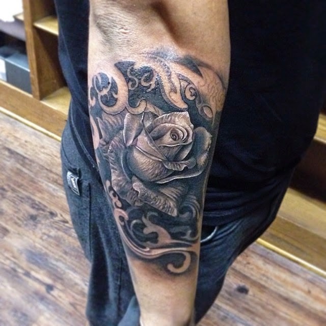 Realism style colored forearm tattoo of detailed rose