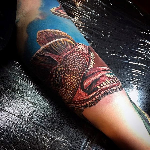 Realism style colored forearm tattoo of ancient dinosaur