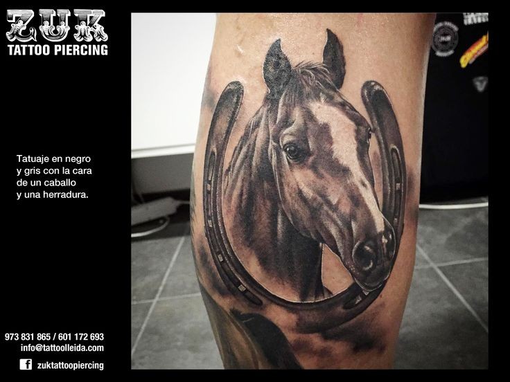 Realism style colored leg tattoo of detailed horse with horseshoe