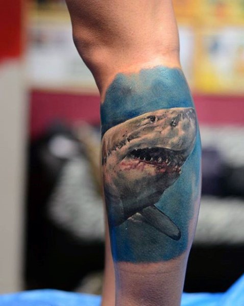Realism style colored leg tattoo of bloody shark