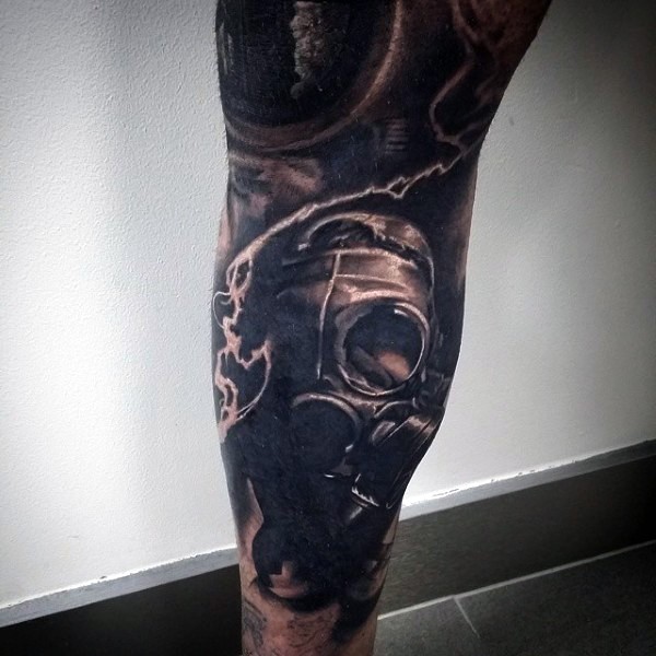 Realism style colored leg tattoo of man in gas mask