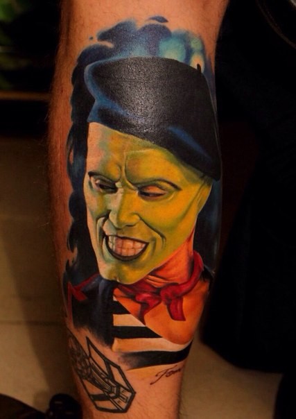 Realism style colored leg tattoo of Mask movie hero portrait