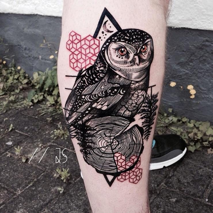 Realism style colored leg tattoo of owl with tree branch and symbols
