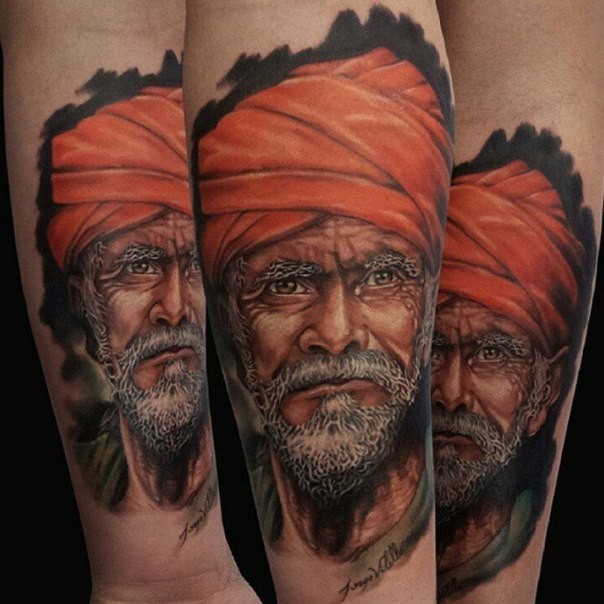 Realism style colored man portrait tattoo