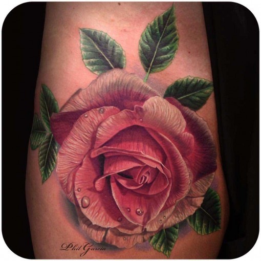 Realism style colored rose tattoo with leaves