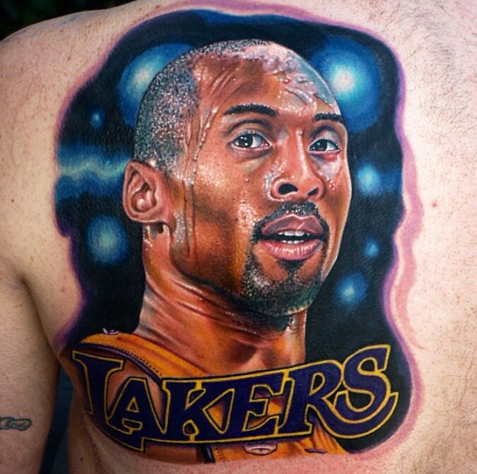 Realism style colored scapular tattoo of Kobe Bryant portrait with lettering