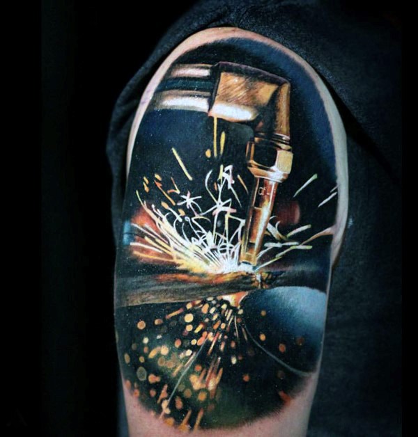 Realism style colored shoulder tattoo of welding works