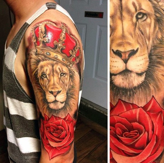 Realism style colored shoulder tattoo of lion with crown and rose