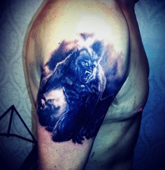 Realism style colored shoulder tattoo of evil werewolf