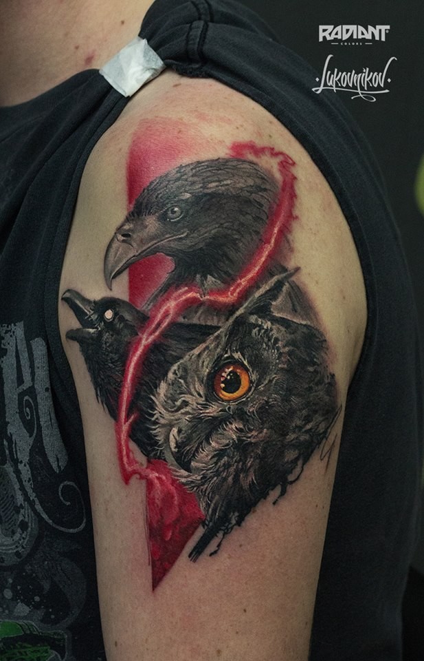 Realism style colored shoulder tattoo of various birds heads